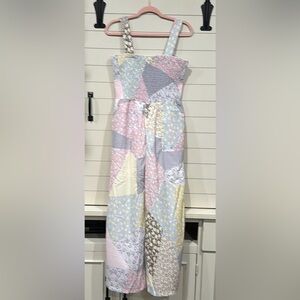 Brand new patchwork style jumpsuit with pockets. Fits a large.